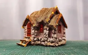 用纸板和石子制作茅草小屋